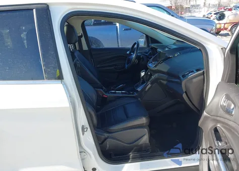 2014 Ford Escape Titanium z USA, uszkodzony, nr VIN 1FMCU0J99EUA91053